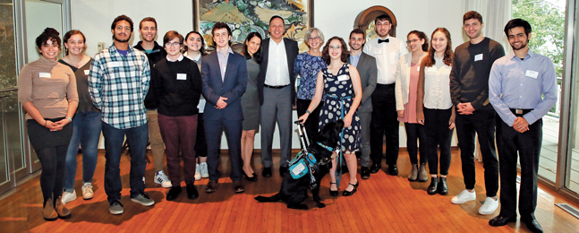 A group of people stand with Ron and Jessica Liebowitz.